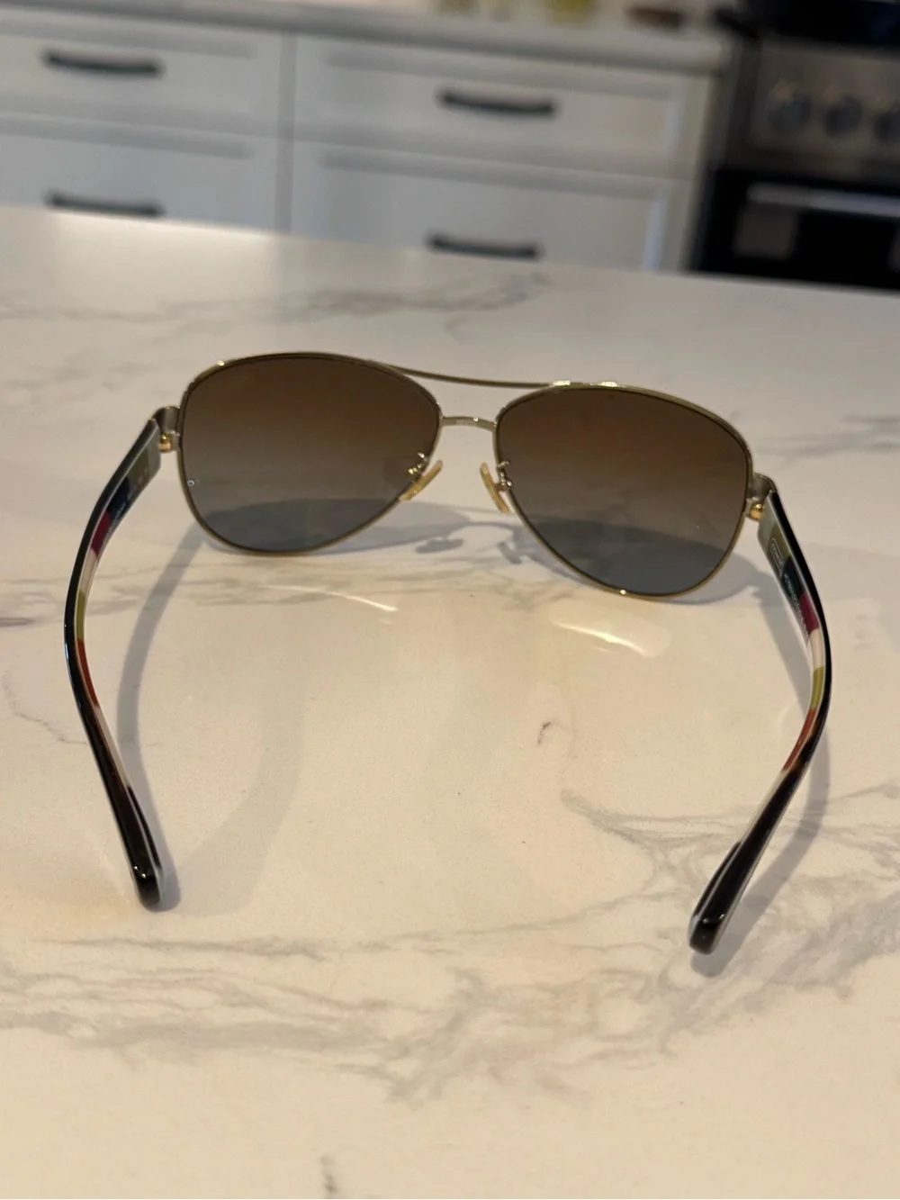 Coach Kristina HC7003 Aviator Gold Frame Sunglasses with Brown Gradient Lenses